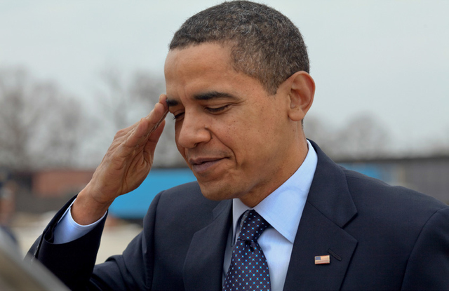 President Barack Obama salutes at Andrews Air Force Base before departing for Columbus, Ohio in March of 2009