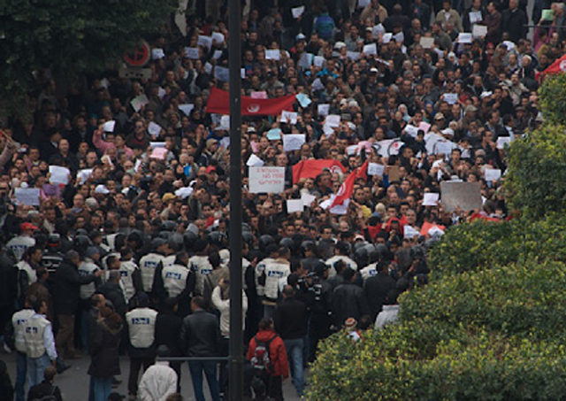Tunisian protestors take to the streets, sparking the Arab Spring.