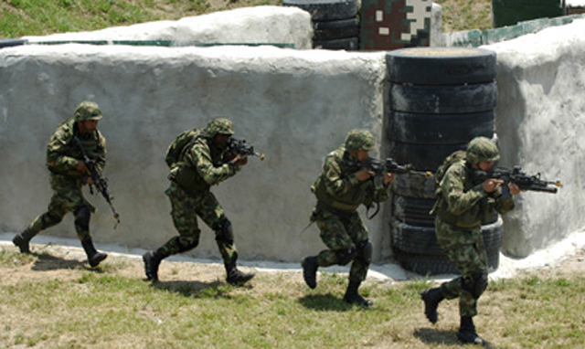 Colombian Special Forces soldiers training for combat.