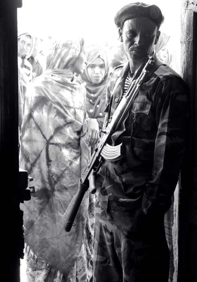 Somaliland soldier at the doorway to a polling center during 2012 elections.