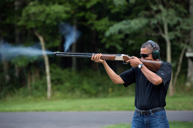 President Obama firing a shotgun at Camp David