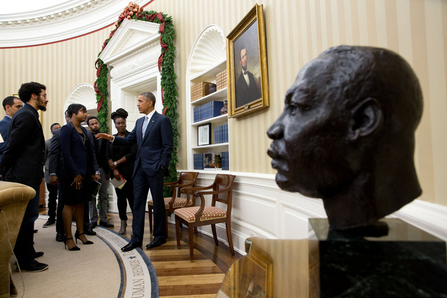 President Obama with a bust of Martin Luther King Jr. in the foreground