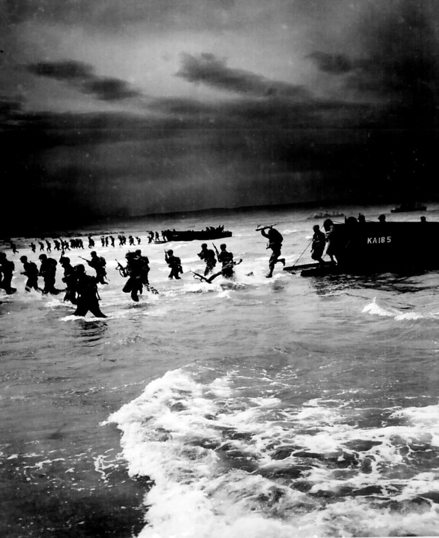 US troops storm a beach in North Africa during World War II.